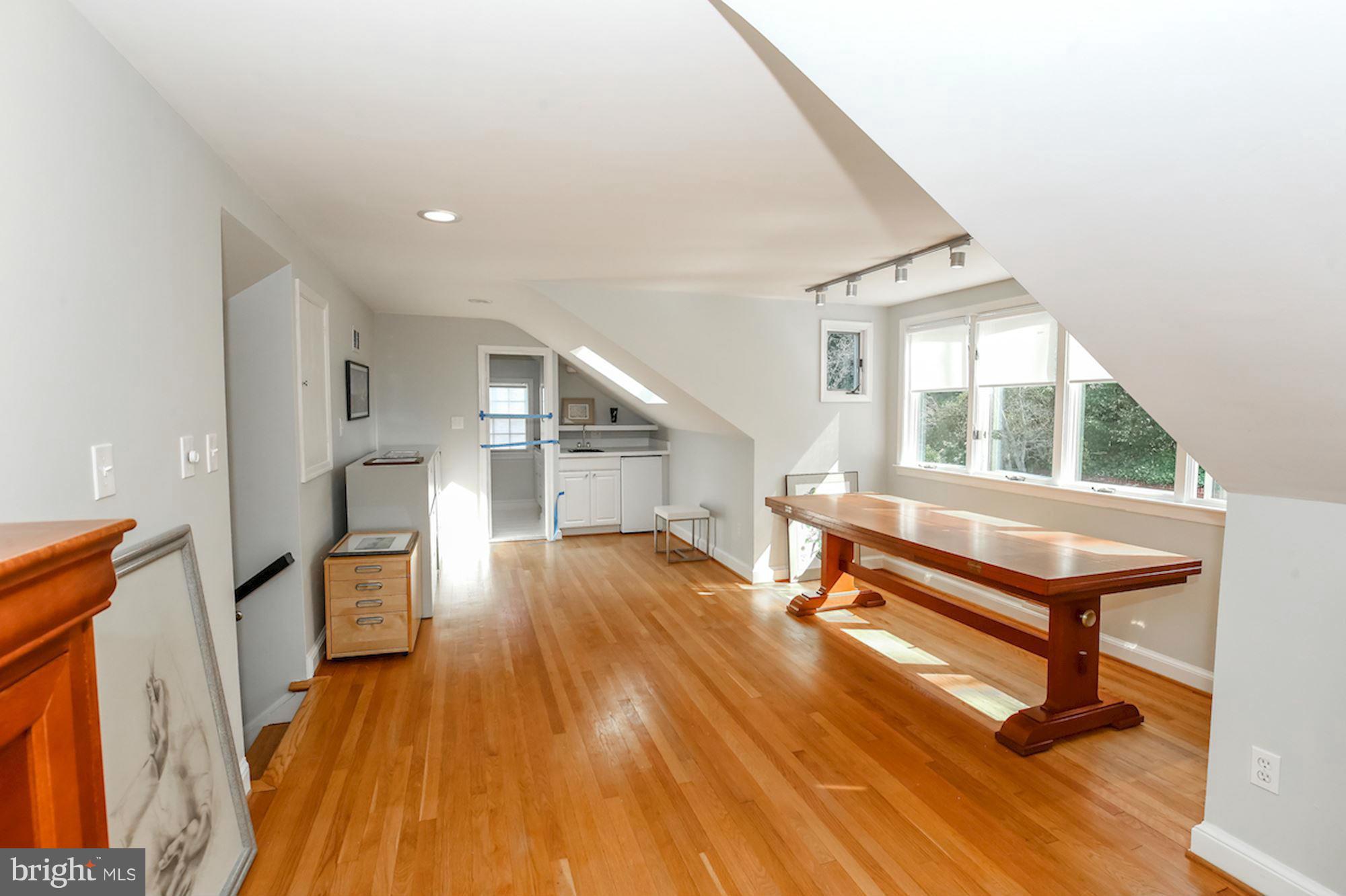 2347 49th Street Northwest Washington, DC 20007 - Photo 28 of 29 a view of a hallway with wooden floor and staircase