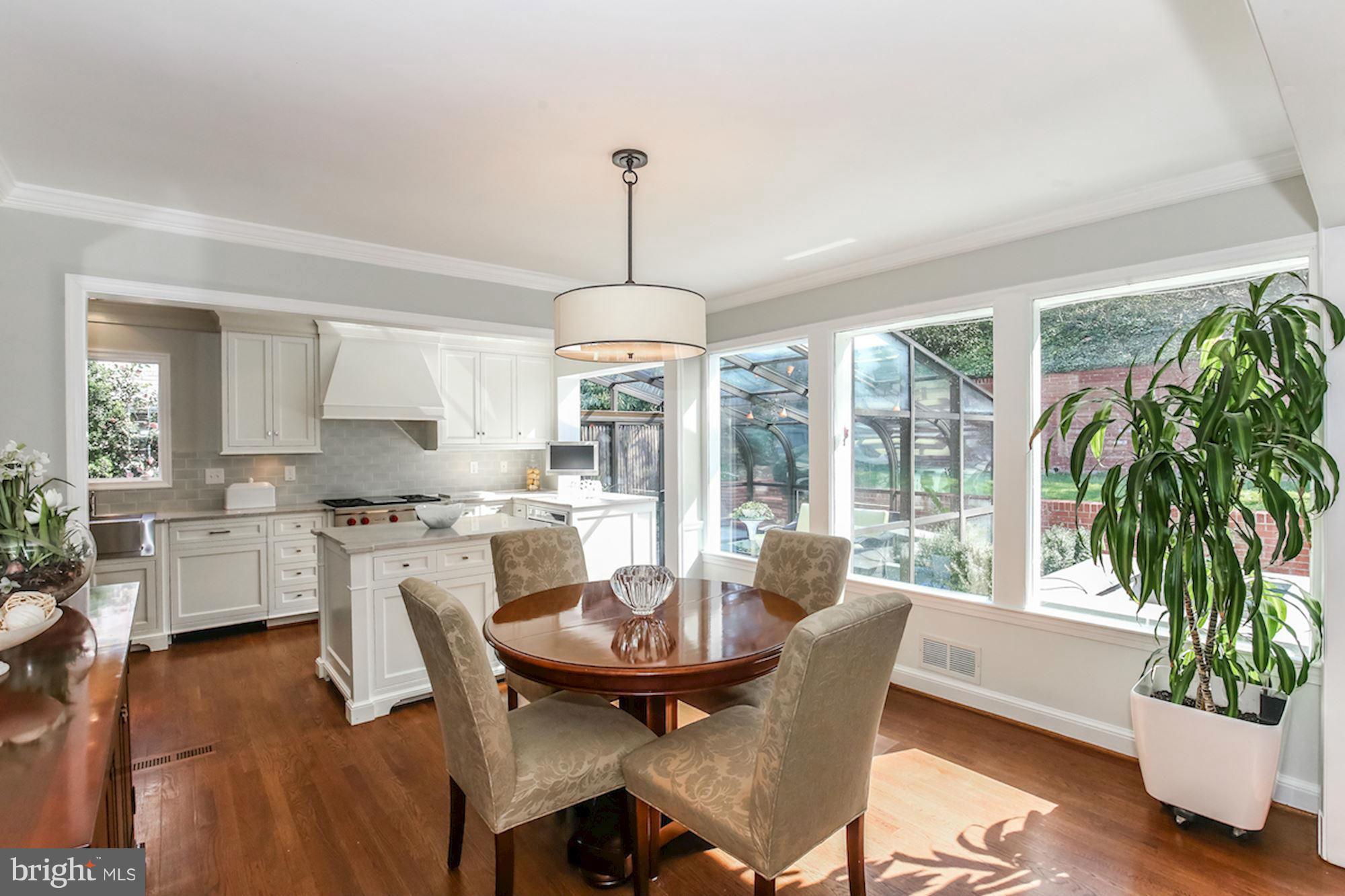 2347 49th Street Northwest Washington, DC 20007 - Photo 5 of 29 a dining room with furniture window and wooden floor