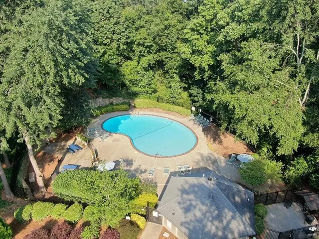 a view of a mini pool with a yard