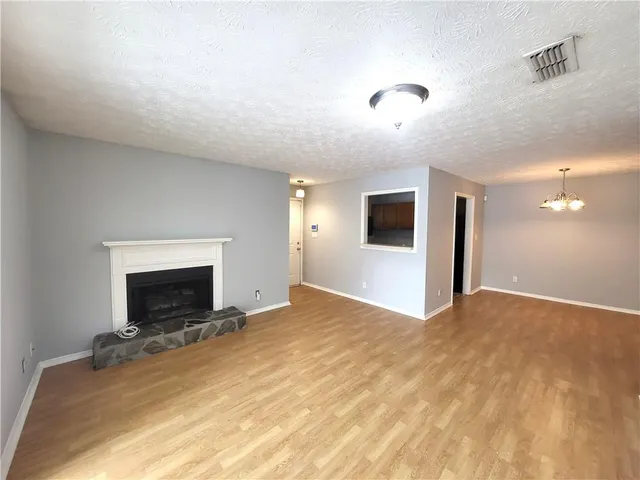 a kitchen with a sink stove and microwave