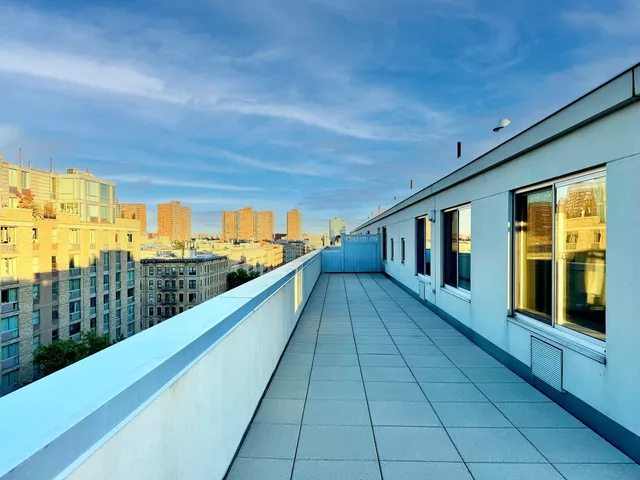 a view of swimming pool with seating space