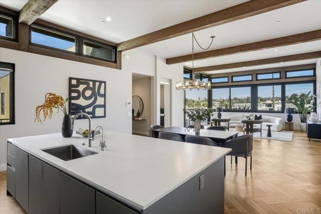 a kitchen with a table chairs and a stove
