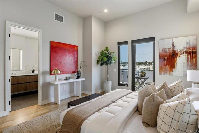 a bedroom with a bed and a couch