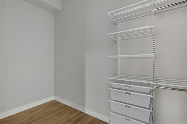 a view of parking garage with cars parked