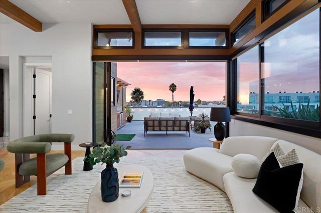 a lobby with furniture and a potted plant