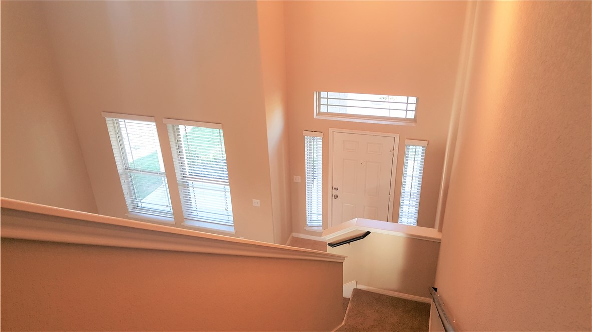 1509 Hamiltons Way Leander, TX 78641 - Photo 18 of 34 entry looking down from top of stairs