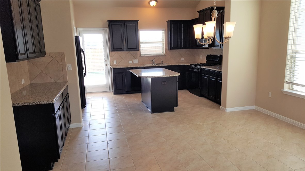 1509 Hamiltons Way Leander, TX 78641 - Photo 4 of 34 Kitchen and dining area
