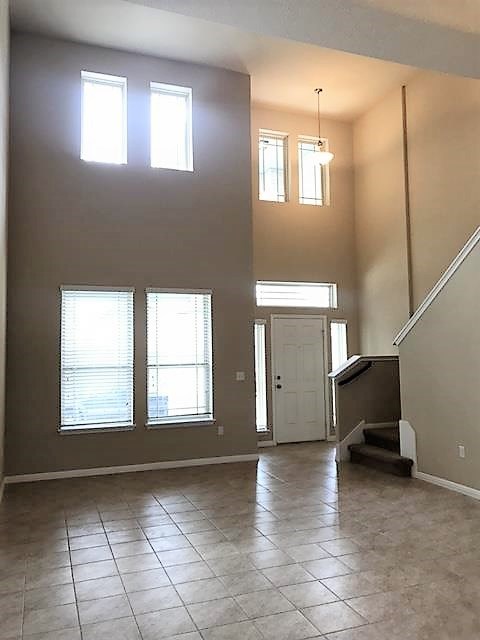 1509 Hamiltons Way Leander, TX 78641 - Photo 7 of 34 family room and entry with dramatic 2 story ceilings