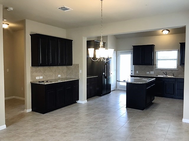 1509 Hamiltons Way Leander, TX 78641 - Photo 10 of 34 kitchen and dining area. Center island and lots of prep space for the chef