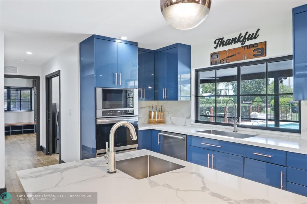 17531 Southwest 68th Court Southwest Ranches, FL 33331 - Photo 14 of 59 a kitchen with a sink a counter and cabinets