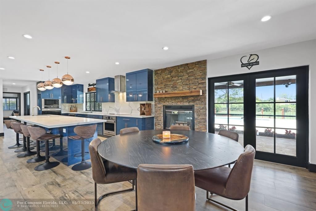 17531 Southwest 68th Court Southwest Ranches, FL 33331 - Photo 16 of 59 a view of a dining room with furniture and wooden floor