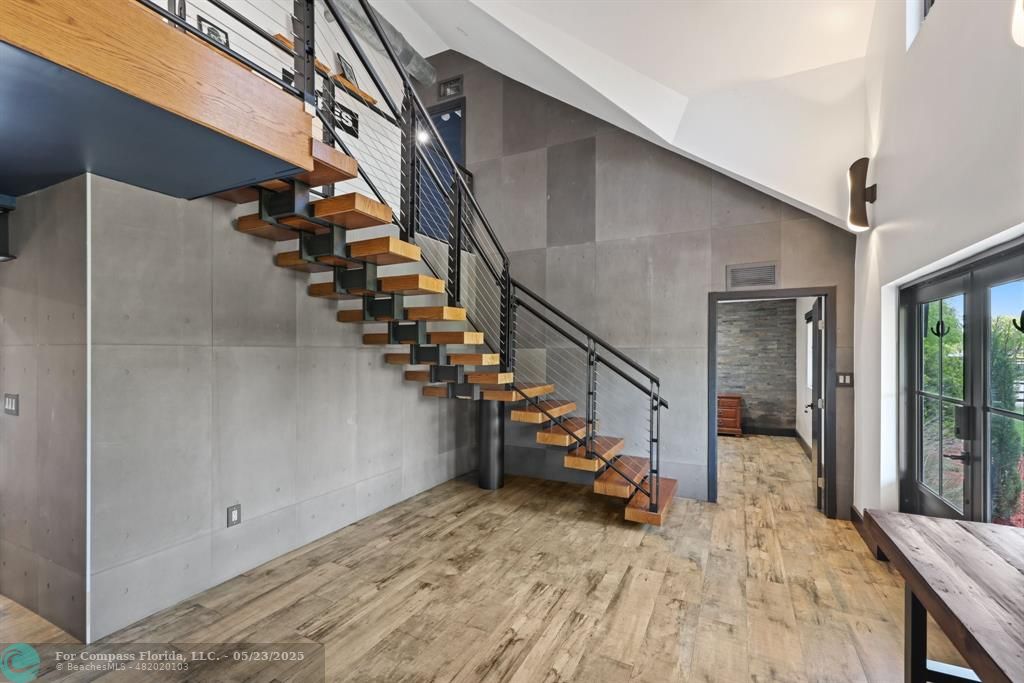 17531 Southwest 68th Court Southwest Ranches, FL 33331 - Photo 17 of 59 a view of a livingroom with wooden floor and stairs