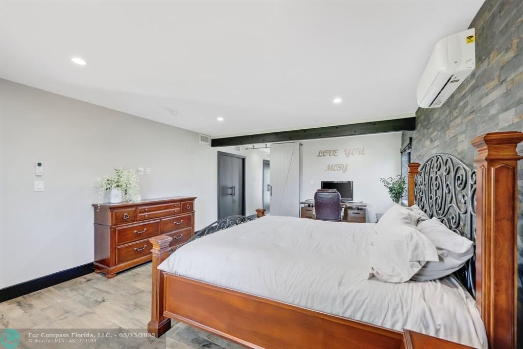 17531 Southwest 68th Court Southwest Ranches, FL 33331 - Photo 19 of 59 a bed room with a bed and a dresser