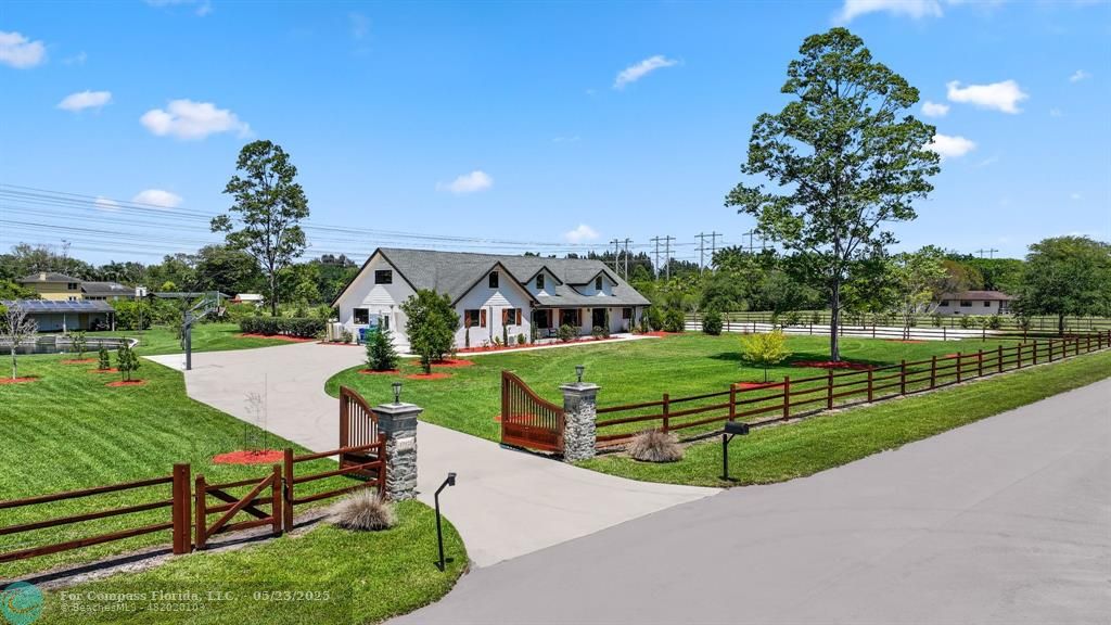 17531 Southwest 68th Court Southwest Ranches, FL 33331 - Photo 2 of 59 a view of a garden with houses