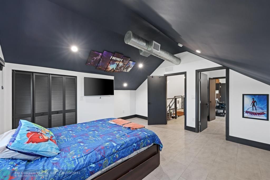 17531 Southwest 68th Court Southwest Ranches, FL 33331 - Photo 25 of 59 a bed room with a bed and a television