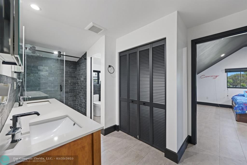 17531 Southwest 68th Court Southwest Ranches, FL 33331 - Photo 27 of 59 a bathroom with a sink and mirror