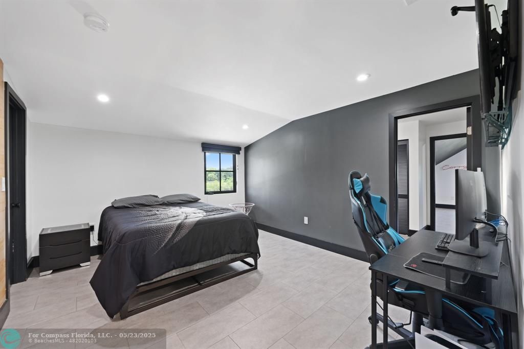 17531 Southwest 68th Court Southwest Ranches, FL 33331 - Photo 28 of 59 a room with a bed and furniture