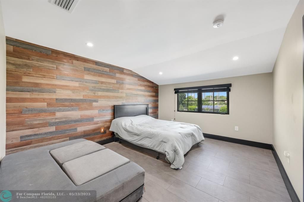 17531 Southwest 68th Court Southwest Ranches, FL 33331 - Photo 30 of 59 a bedroom with two beds and a window