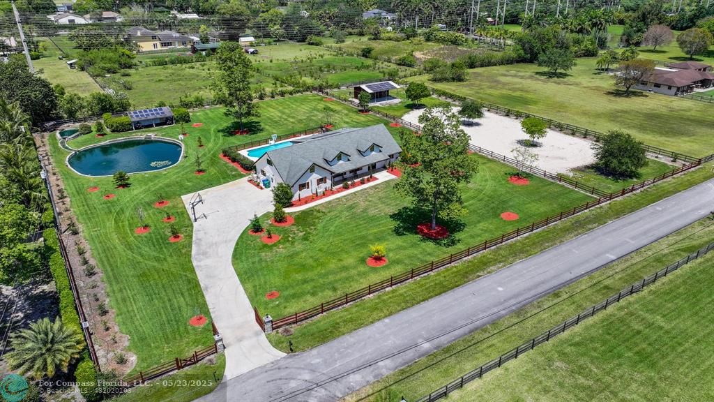 17531 Southwest 68th Court Southwest Ranches, FL 33331 - Photo 4 of 59 a view of a wooden bridge with a yard