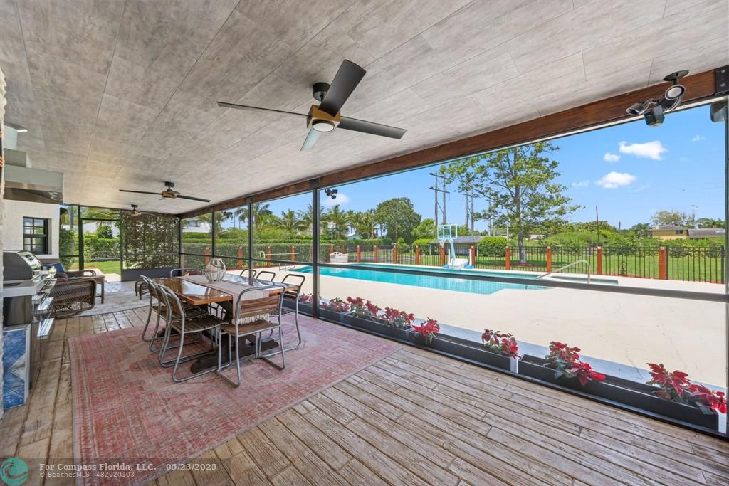 17531 Southwest 68th Court Southwest Ranches, FL 33331 - Photo 41 of 59 a view of a patio with lawn chairs next to a yard