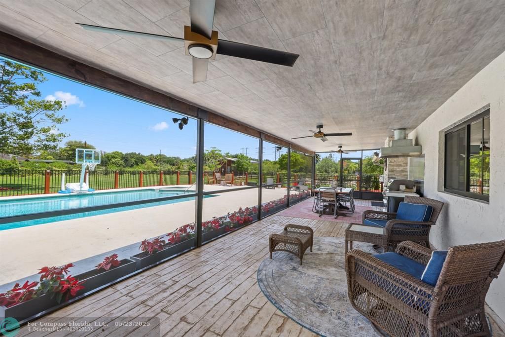 17531 Southwest 68th Court Southwest Ranches, FL 33331 - Photo 42 of 59 a living room with furniture and a large window