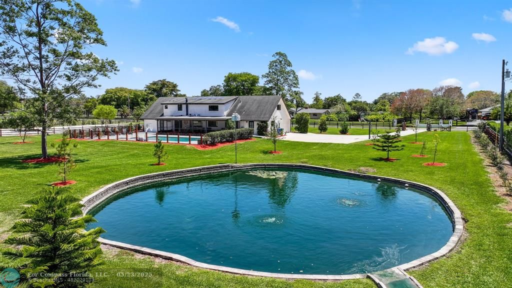 17531 Southwest 68th Court Southwest Ranches, FL 33331 - Photo 49 of 59 a view of a swimming pool and a yard