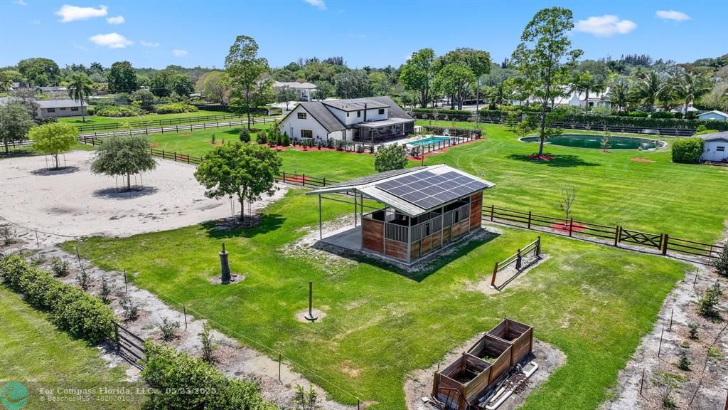 17531 Southwest 68th Court Southwest Ranches, FL 33331 - Photo 52 of 59 an aerial view of a house with swimming pool garden and outdoor seating