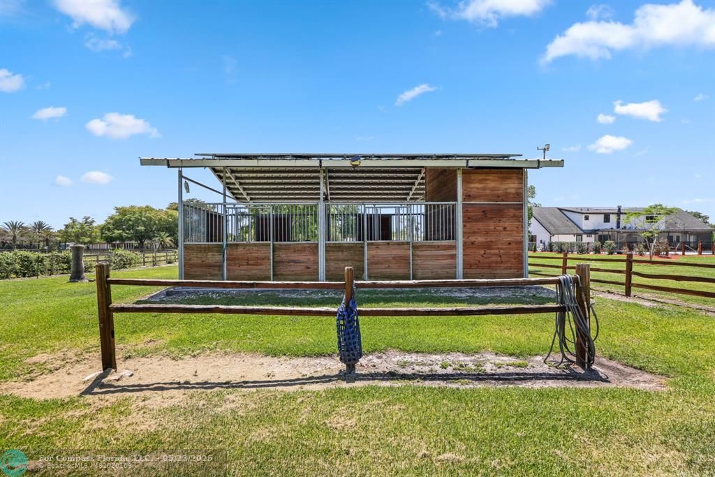 17531 Southwest 68th Court Southwest Ranches, FL 33331 - Photo 53 of 59 a view of a house with a yard