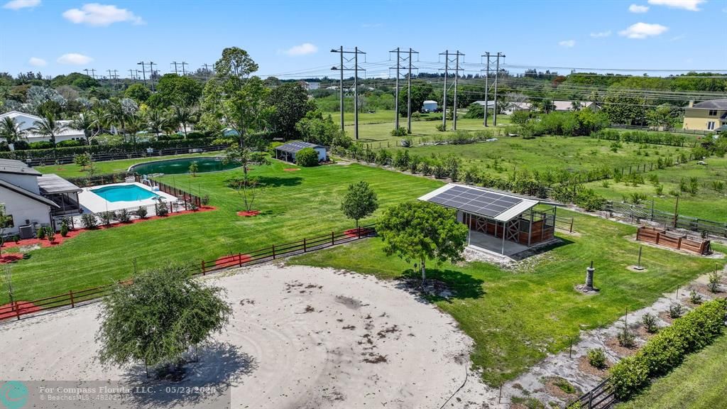 17531 Southwest 68th Court Southwest Ranches, FL 33331 - Photo 56 of 59 a view of a garden with houses