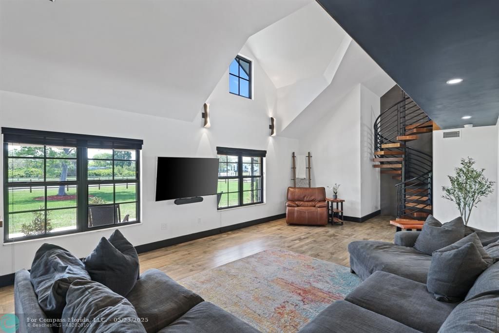 17531 Southwest 68th Court Southwest Ranches, FL 33331 - Photo 9 of 59 a living room with furniture window and a flat screen tv