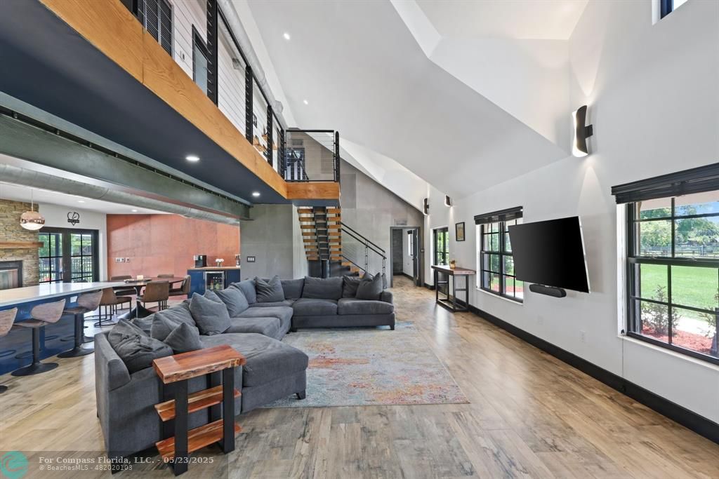 17531 Southwest 68th Court Southwest Ranches, FL 33331 - Photo 10 of 59 a living room with furniture and a flat screen tv