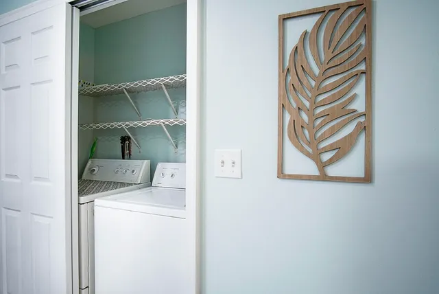 a bedroom with a bed and a large mirror