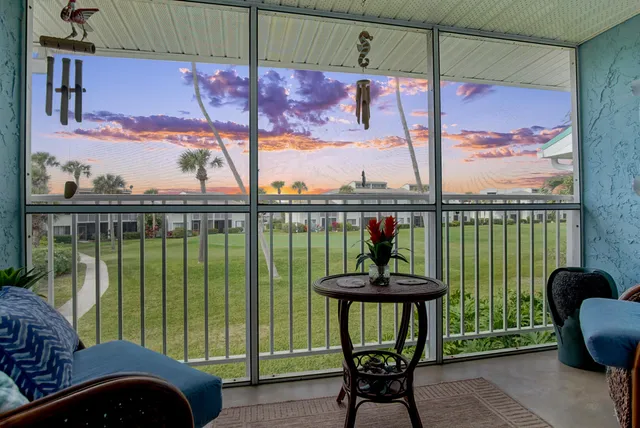 a view of a hallway with paintings on the wall