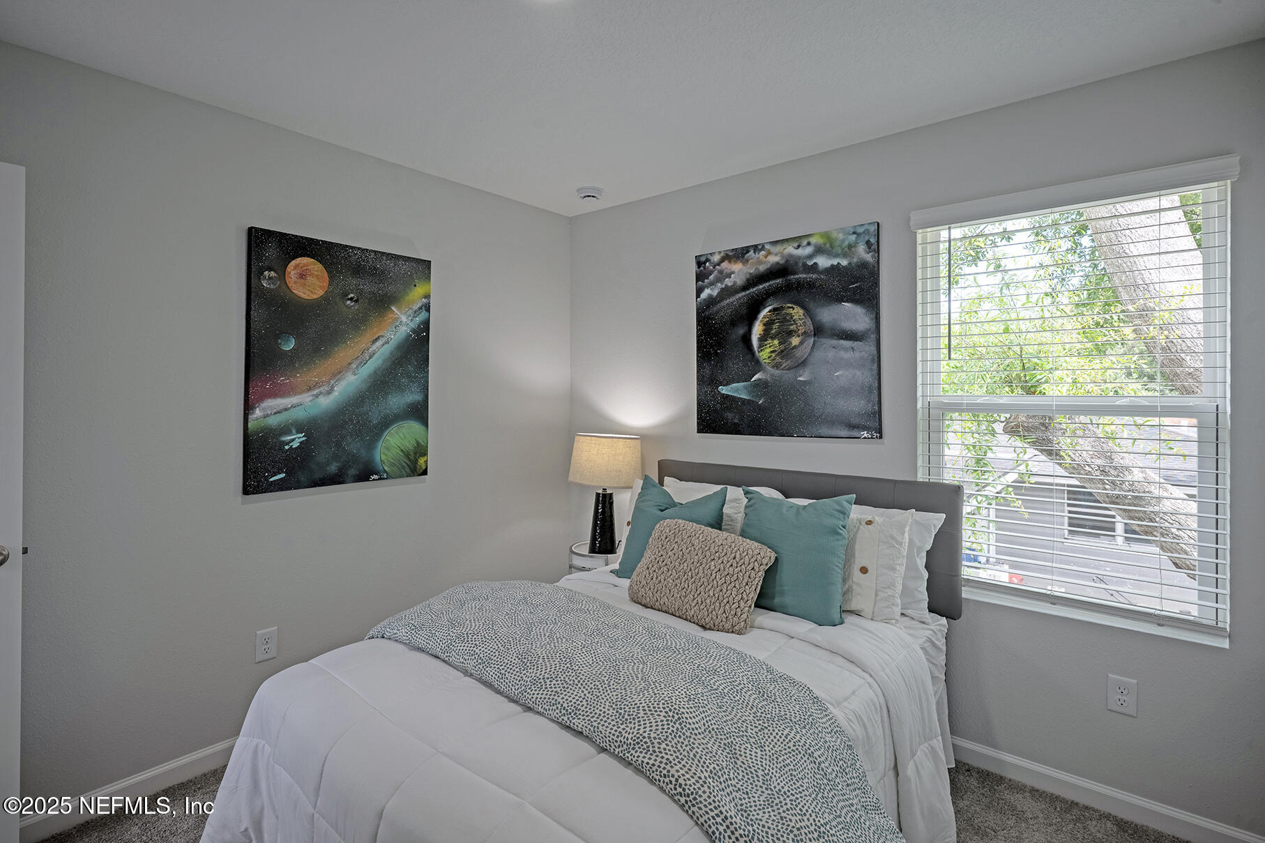 4906 Spring Glen Road Jacksonville, FL 32207 - Photo 34 of 43 a bedroom with a bed and a painting on the wall