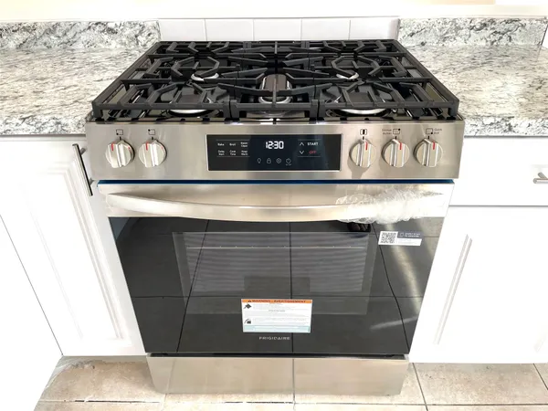 a view of a fireplace with wooden floor