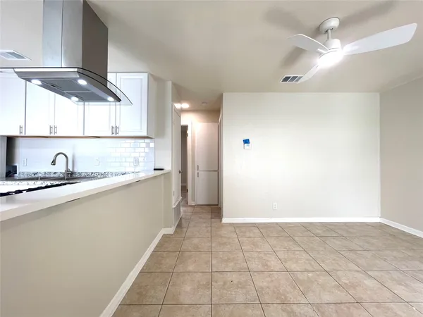 a view of a kitchen with a sink and a window