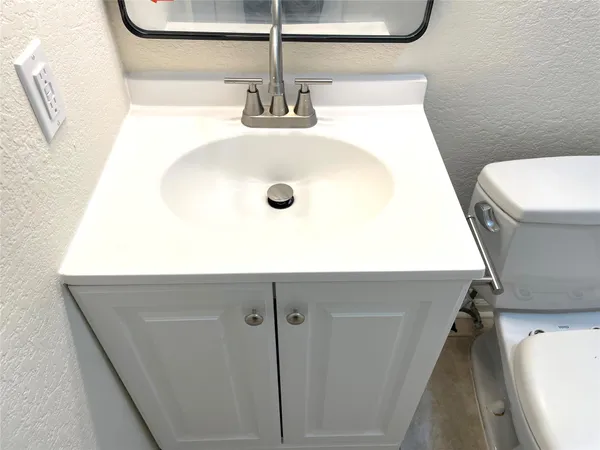 a stove top oven sitting inside of a kitchen