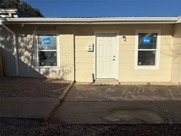 a view of entrance gate of a house