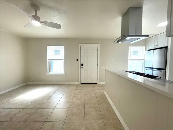 a view of a kitchen with a sink and a window