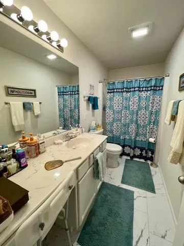 a bathroom with a sink double vanity and a mirror