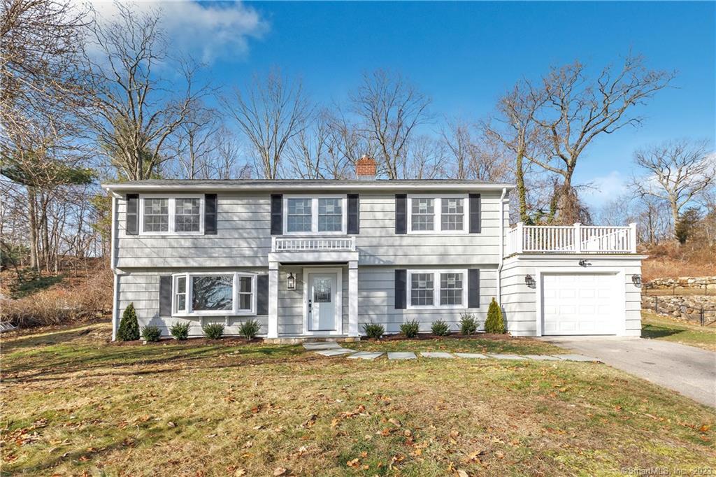 27 Shawnee Road Trumbull, CT 06611 - Photo 1 of 1 a front view of a house with a garden