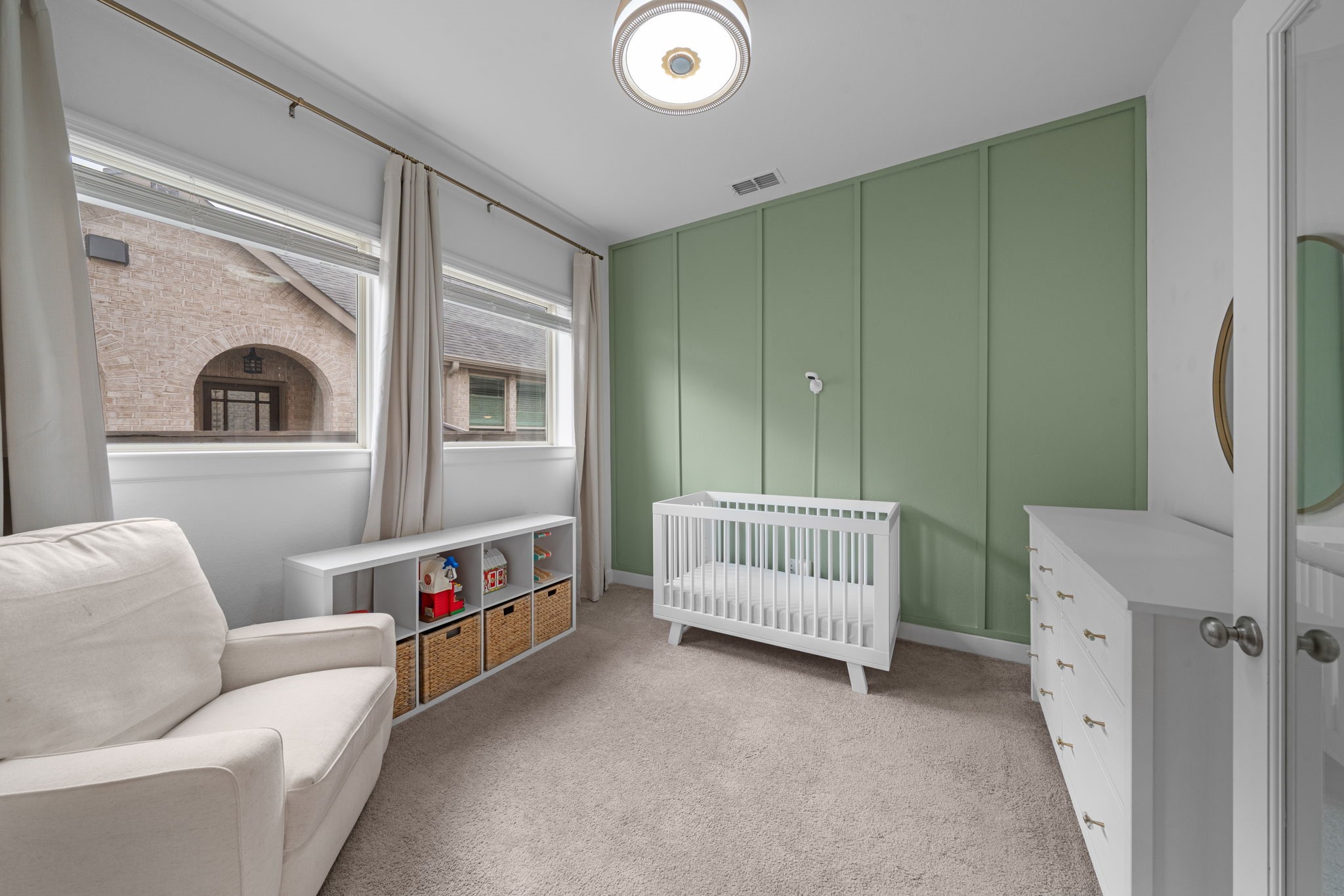 15119 Barbado Ridge Trail Cypress, TX 77433 - Photo 14 of 37 A unique, modern flush-mount light fixture with a warm wood accent adds a touch of designer flair, while the crisp white walls and plush carpeting provide a clean, quiet backdrop for any professional setup.