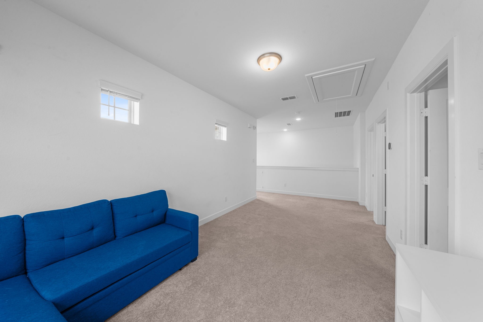 15119 Barbado Ridge Trail Cypress, TX 77433 - Photo 24 of 37 Strategically positioned, this upstairs living space provides seamless access to the surrounding bedrooms and a full bathroom, making it a functional and convenient addition to the home's layout.