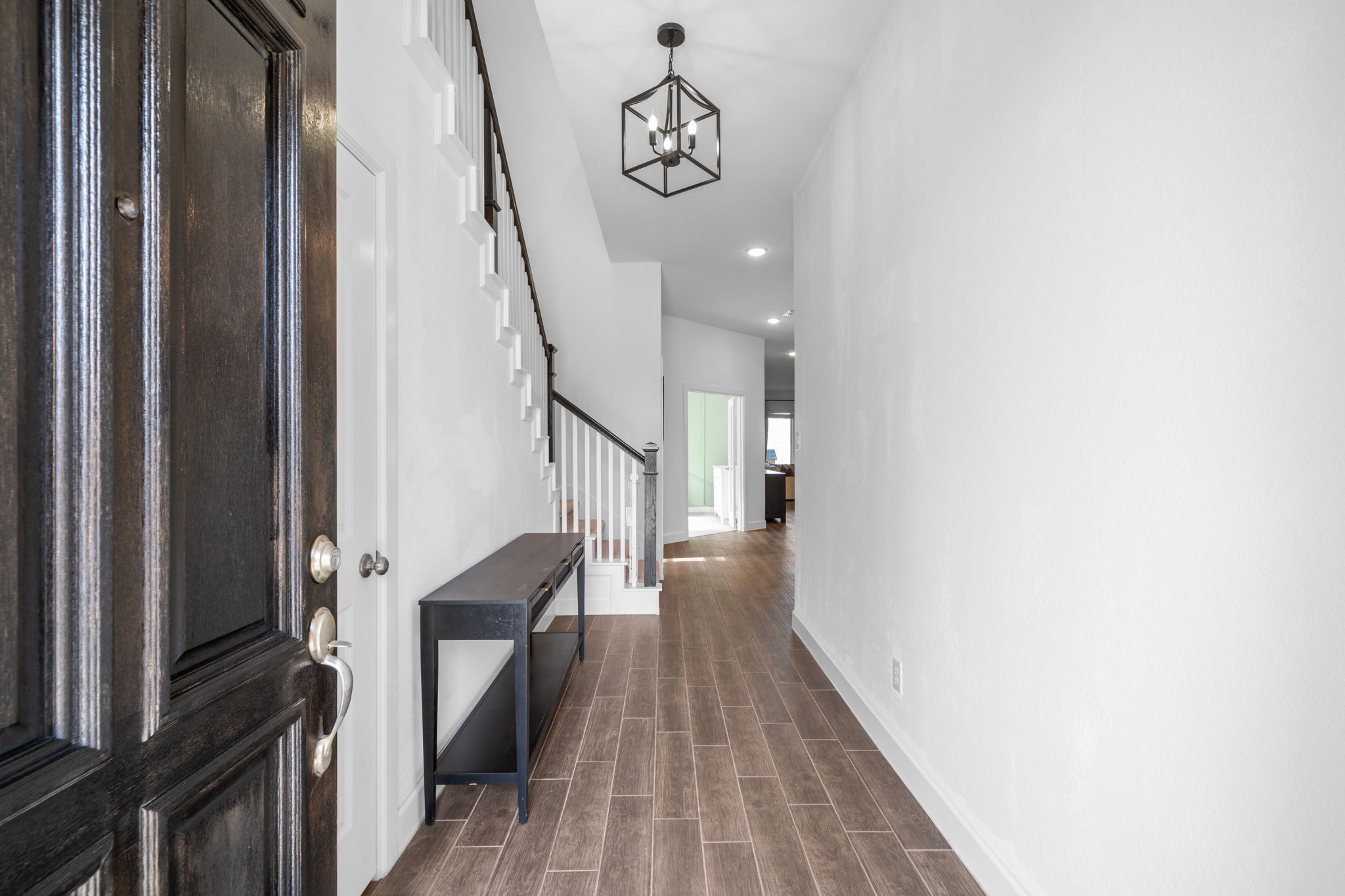 15119 Barbado Ridge Trail Cypress, TX 77433 - Photo 4 of 37 The moment you step through the stately dark-wood front door, you're greeted by a bright and expansive foyer that sets a tone of modern elegance for the entire home.
