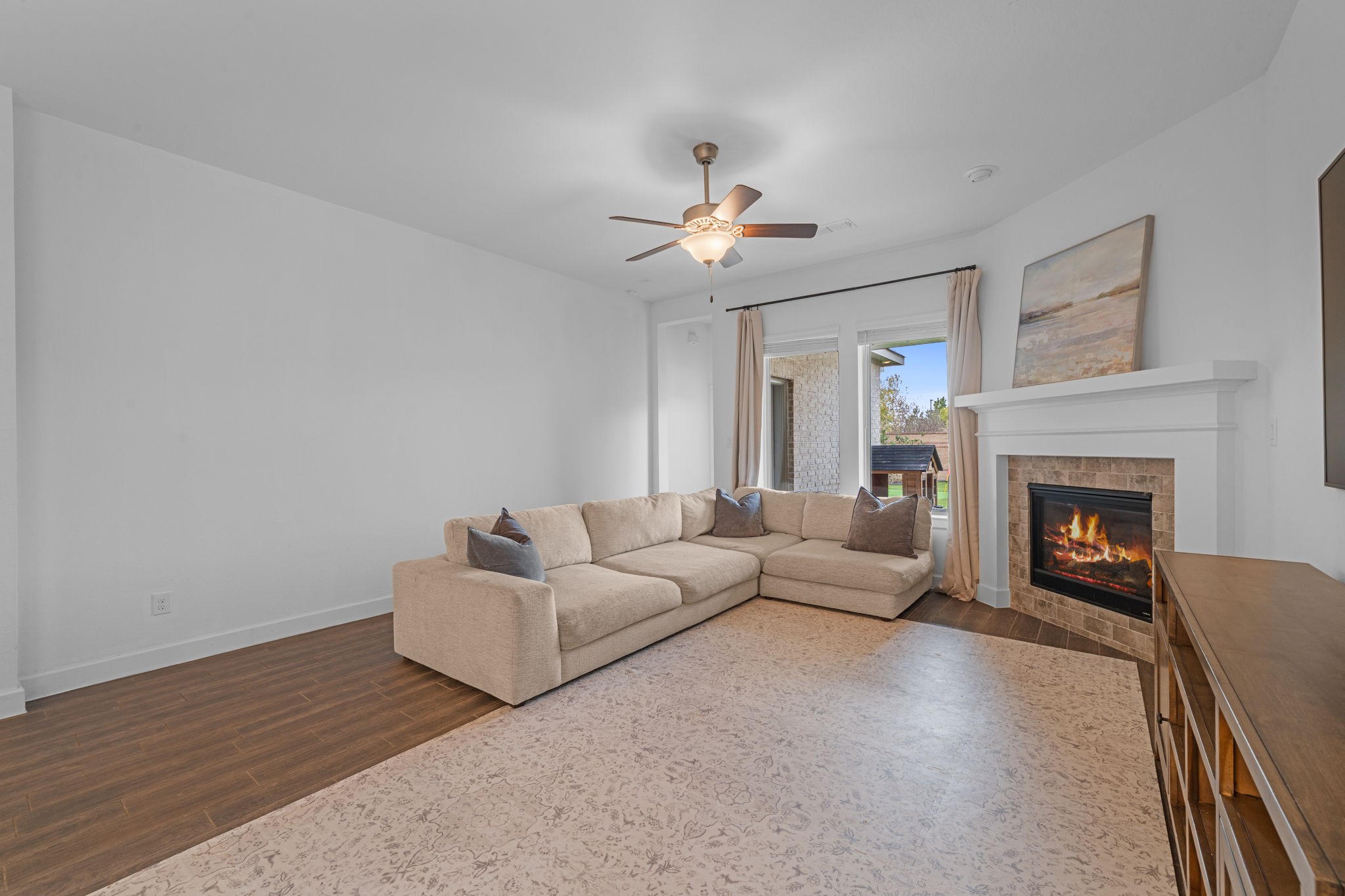 15119 Barbado Ridge Trail Cypress, TX 77433 - Photo 5 of 37 Step into an expansive, light-filled living area designed for both quiet relaxation and effortless entertaining.