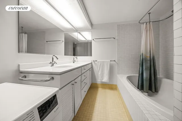 a bedroom with a large bed and a fireplace