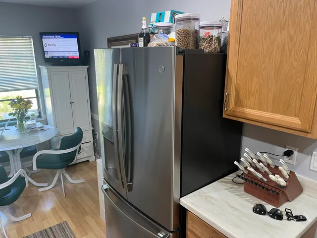 a close view of stove and refrigerator