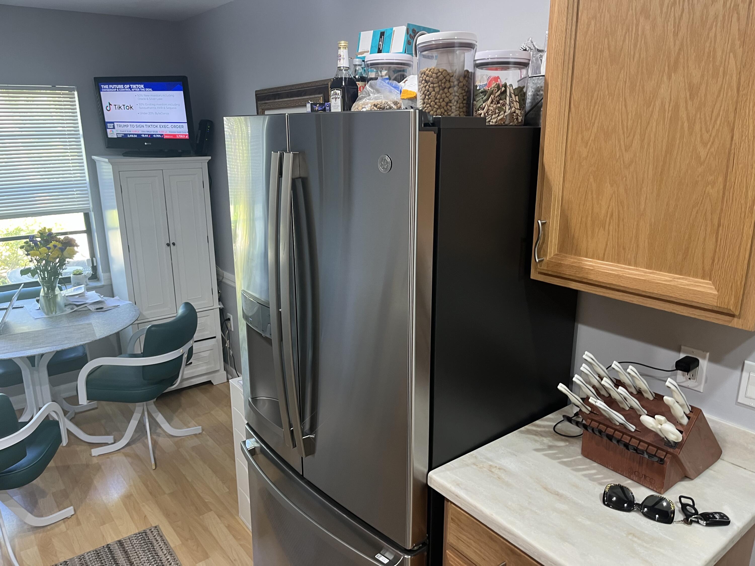 14 Southport Lane, Unit C Boynton Beach, FL 33436 - Photo 13 of 39 a kitchen with refrigerator and window