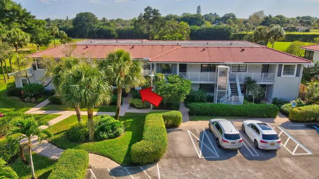 a view of an house with swimming pool and garden