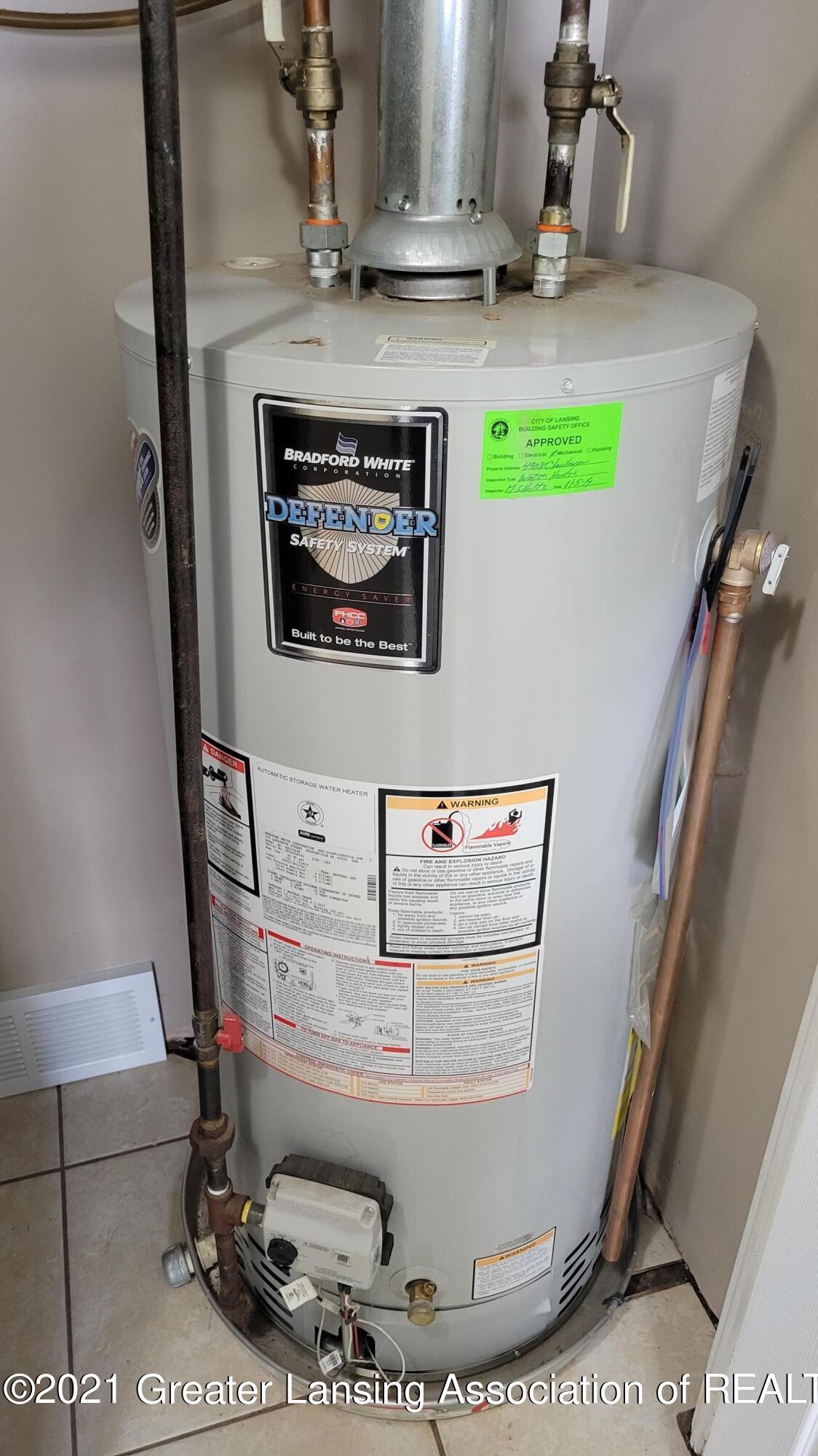 4908 Christiansen Road Lansing, MI 48910 - Photo 23 of 31 Water heater